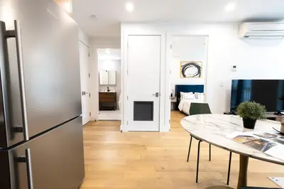 a kitchen and living room with a refrigerator and a table at 149BK-302 New Construction 1BR WD in unit Balcony in Brooklyn