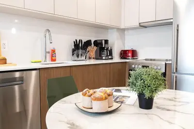 a kitchen with a table with some food on it at 149BK-302 New Construction 1BR WD in unit Balcony in Brooklyn
