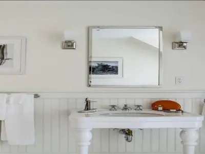 a white bathroom with a sink and a mirror at The White Hart in Salisbury