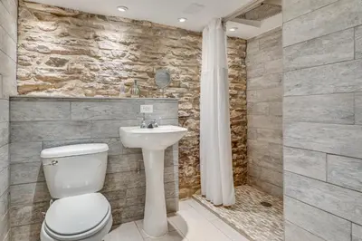 a bathroom with a toilet and a sink at 5 Mi to Belleayre Lake Getaway in Fleischmanns! in Fleischmanns