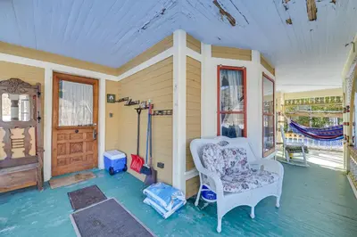 a living room with a chair and a window at 5 Mi to Belleayre Lake Getaway in Fleischmanns! in Fleischmanns
