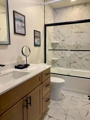 a bathroom with a sink and a toilet and a shower at Luxury TownHome 106 in Wilmington