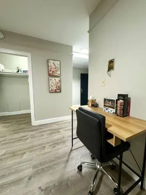 an office with a desk and a chair in a room at Yale Casa Rosa Studio in New Haven