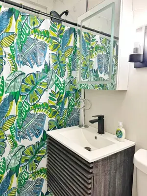 a bathroom with a sink and a mirror at Yale Casa Verde Studio in New Haven