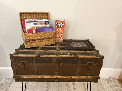 an old trunk with a basket and books on top of it at Yale Casa Azul Studio in New Haven