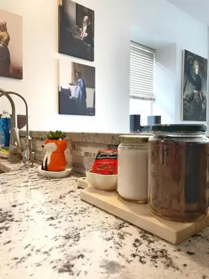 a kitchen counter with jars on a counter top at Yale Modern Downtown Chateau in New Haven