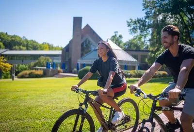 a group of people riding bikes in a yard at Windrose on Hudson in Ossining