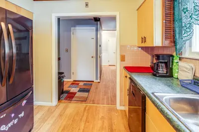 a kitchen with a sink and a counter top at 9 Mi to Lake George Village Home in Queensbury in Queensbury
