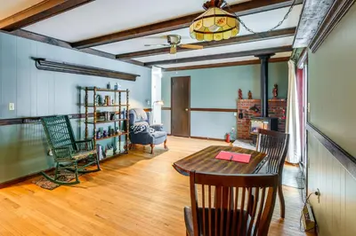 a living room with a table and chairs at 9 Mi to Lake George Village Home in Queensbury in Queensbury
