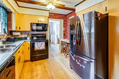 a kitchen with a stainless steel refrigerator at 9 Mi to Lake George Village Home in Queensbury in Queensbury