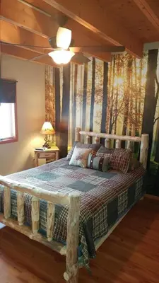 a bedroom with a bed with a wooden ceiling at Pocono Mountain Retreat in Cresco
