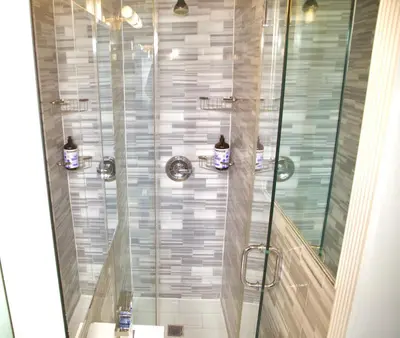 a bathroom with a shower with a glass door at New2 York Style Stay near Central Park in New York