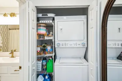 a refrigerator with its door open in a kitchen at The Gallery in Downtown Stamford in Stamford