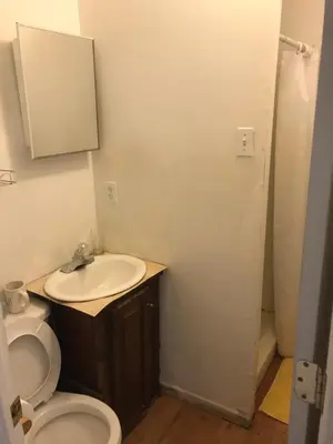 a bathroom with a toilet and a sink at 1Br Studio Across From Yale New Haven Hospital in New Haven