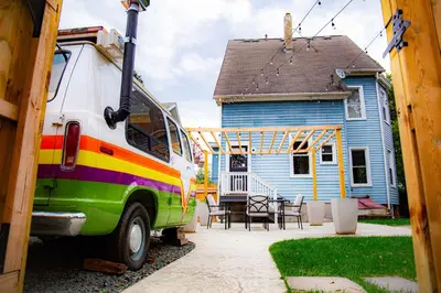 a colorful van parked in front of a house at Spacious Home with Yard and Patio, 2 Mi to Dtwn Troy in Troy
