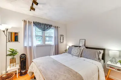 a bedroom with a large bed and a window at Peaceful 1-Acre Parksville Home Large Deck and Yard in Parksville
