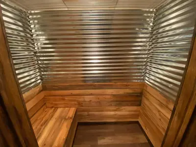 a sauna with wooden walls and a wooden floor at STUNNING RENOVATED 4BR House in Southington