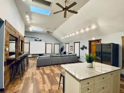 a large living room with a couch and a table at STUNNING RENOVATED 4BR House in Southington