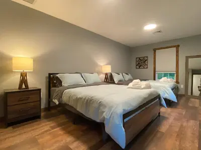 a bedroom with two beds and two lamps in it at STUNNING RENOVATED 4BR House in Southington