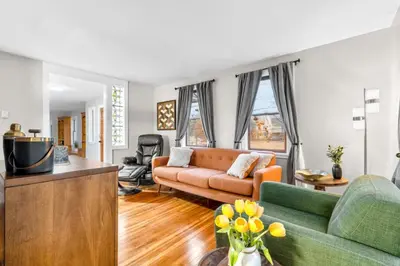 a living room with a couch and a table at Spacious Cozy 3 Bed 2 Bath in Southington