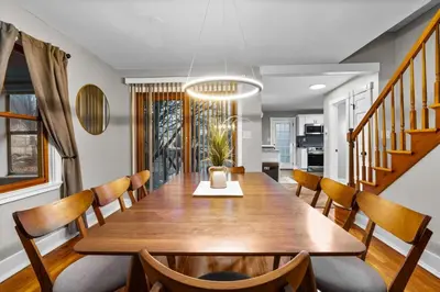a dining room with a table and chairs at Spacious Cozy 3 Bed 2 Bath in Southington
