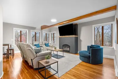 a living room with a couch and a fireplace at Spacious Cozy 3 Bed 2 Bath in Southington