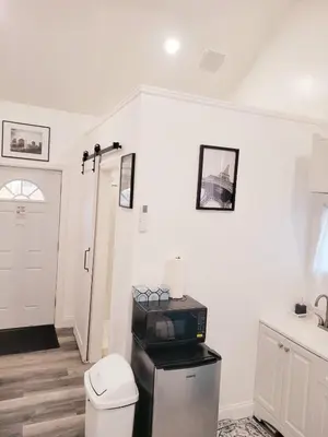 a white bathroom with a toilet and a sink at Private studio guesthouse in Watertown CT in Watertown
