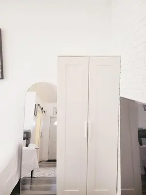 a white cabinet in a room with a mirror at Private studio guesthouse in Watertown CT in Watertown