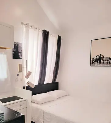 a white room with a bed and a window at Private studio guesthouse in Watertown CT in Watertown