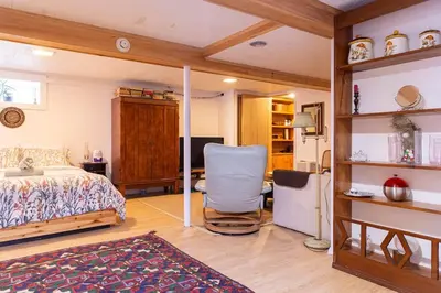 a bedroom with a bed and a desk and a chair at Charming home - views of Hunter Mountain slopes in Hunter