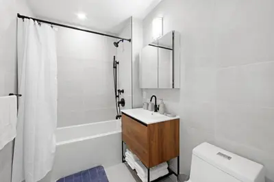 a bathroom with a sink and a toilet and a shower at 149BK-501 New 2br 2baths with a Private Terrace in Brooklyn