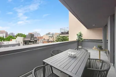 a table and chairs on a balcony with a view at 149BK-501 New 2br 2baths with a Private Terrace in Brooklyn