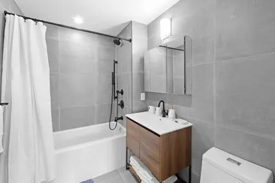 a bathroom with a sink and a toilet and a shower at 149BK-501 New 2br 2baths with a Private Terrace in Brooklyn