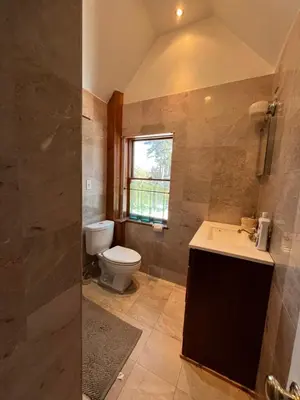 a bathroom with a toilet and a sink at Grand 2BR near MetroNorth with easy parking in Yonkers