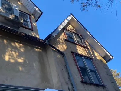 a house with three windows on the side of it at Grand 2BR near MetroNorth with easy parking in Yonkers