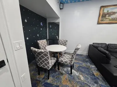 a room with a table and chairs and a couch at The Georges Hidden Gem in Mount Vernon
