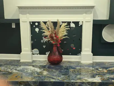 a red vase with plants in it in front of a window at The Georges Hidden Gem in Mount Vernon