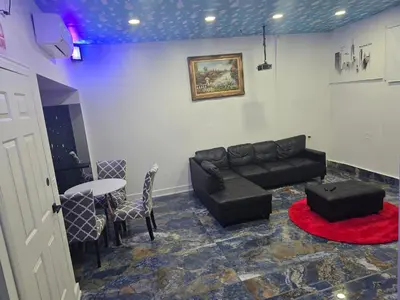 a living room with a couch and a table at The Georges Hidden Gem in Mount Vernon