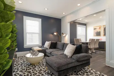 a living room with a couch and a table at Fully-stocked Kitchen, AC, WiFi, WD, Near Baseball and Downtown in Oneonta