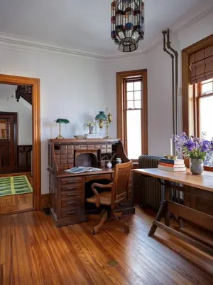 an office with a desk and a computer in a room at The Grand - The Nicest House in Newburgh in Newburgh