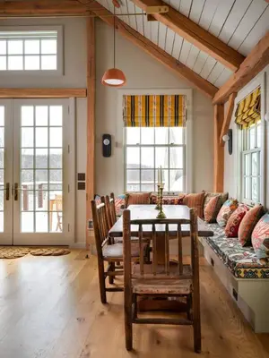 a living room with a couch and a table and chairs at Post & Beam - Stunningly Designed Luxury Home with Pool & Hot Tub in Pine Plains