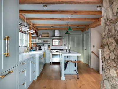 a kitchen with white counters and a wooden ceiling at Post & Beam - Stunningly Designed Luxury Home with Pool & Hot Tub in Pine Plains