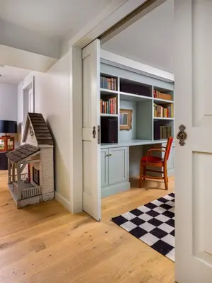 a room with a book shelf and a dog house at Post & Beam - Stunningly Designed Luxury Home with Pool & Hot Tub in Pine Plains