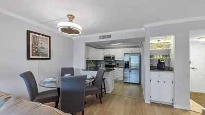 a kitchen and dining room with a table and chairs at MA25188C-103 in New York