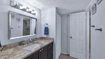 a bathroom with a sink and a mirror at MA25188C-103 in New York
