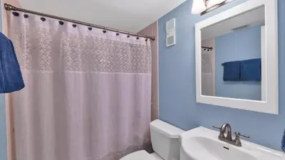 a bathroom with a shower curtain and a sink at MA25188C-103 in New York