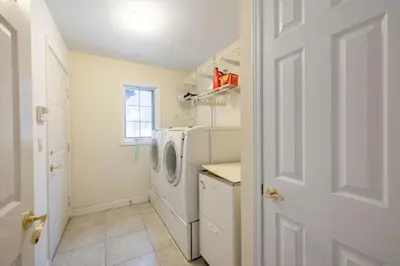 a laundry room with a washer and dryer at Secluded 9BR Getaway, Pool, Hot Tub & Huge Deck in Chester