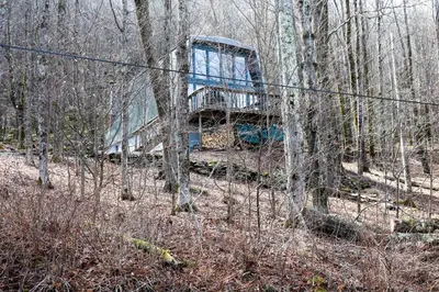 an old truck sitting in the middle of the woods at Heaven on Hunter in Hunter