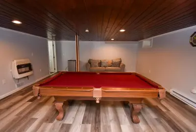 a pool table in a room with a couch at Cozy home away from home in Tobyhanna