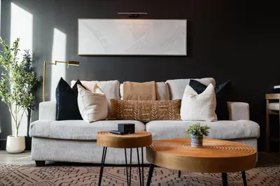 a living room with a couch and a table at Cozy 1 King BR, Gym, Free Parking, 8mins Train in East Orange